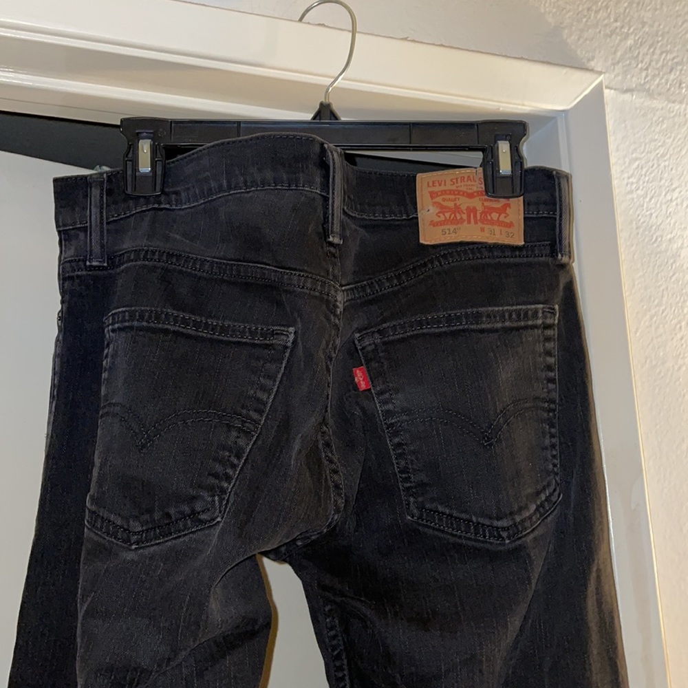 Slightly distressed Levi 514 jeans